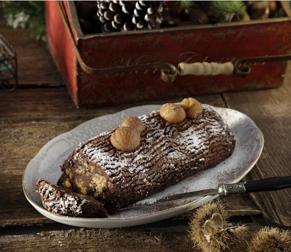 Chocolate log with chestnut spoon sweet, almonds and soumada