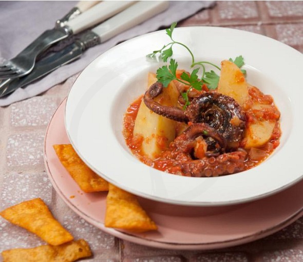 Fish recipe from Corfu (mpourdeto)- octopus combined with lasagne chips with paprika