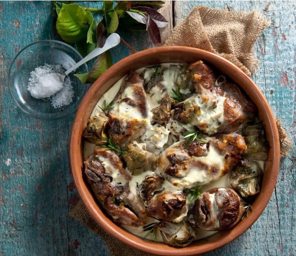 Lamb with yogurt cooked in a baking pan with lid