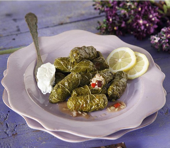 Stuffed vine leaves with olives, peppers and spices